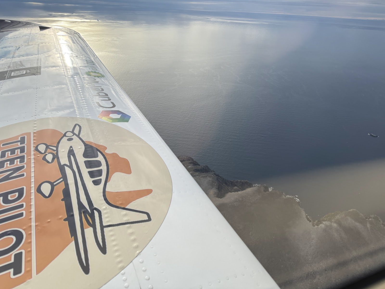 Wing of the Sling TSi above the clouds